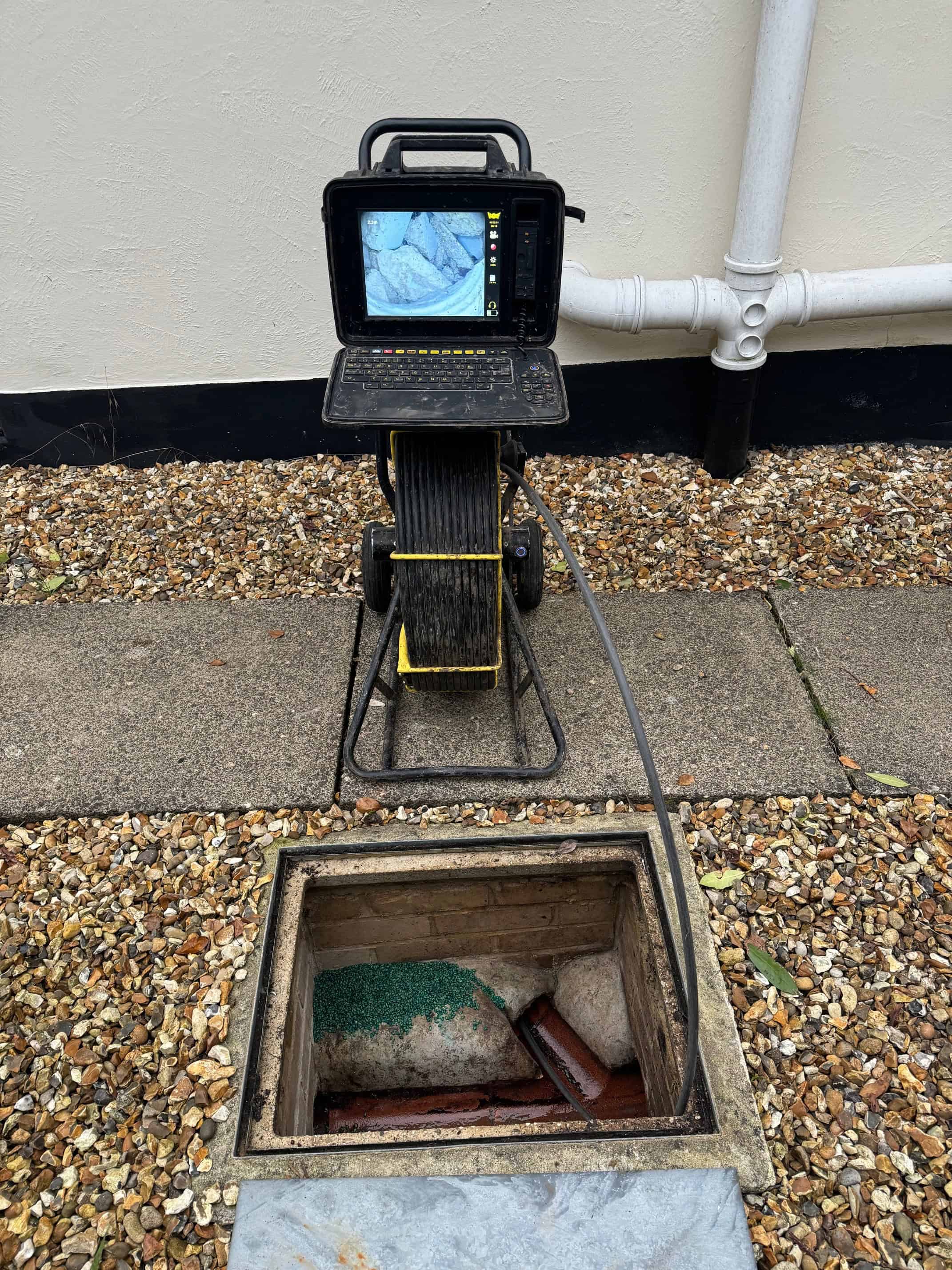 Professional drain inspection camera used for detecting rodent entry points and blockages.